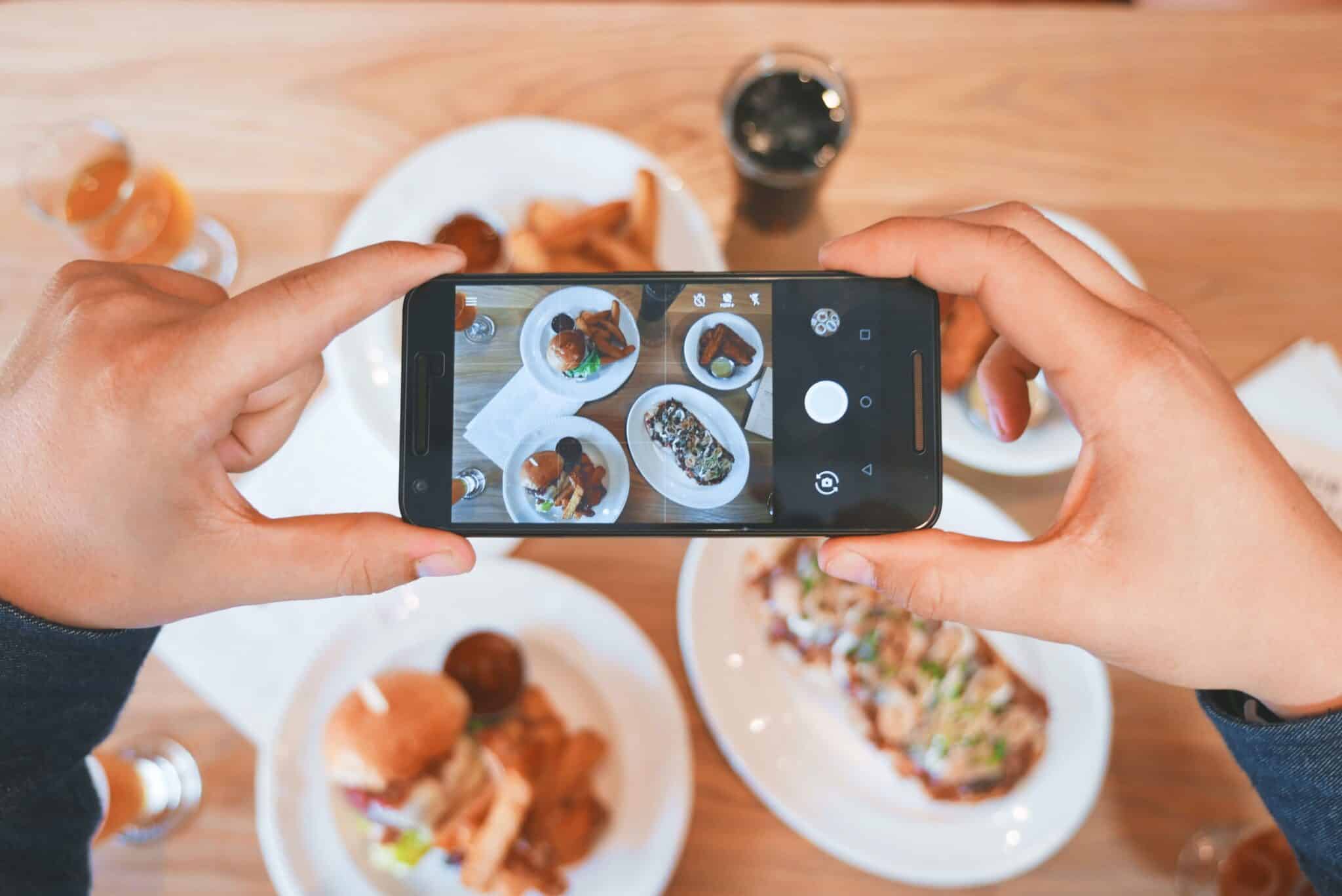 Somebody taking a picture of food with phone
